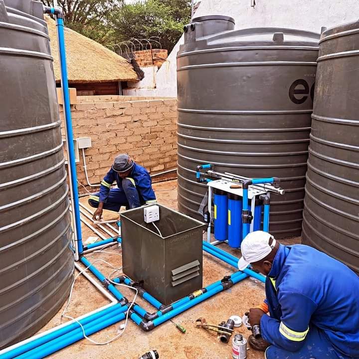 Men working on water system