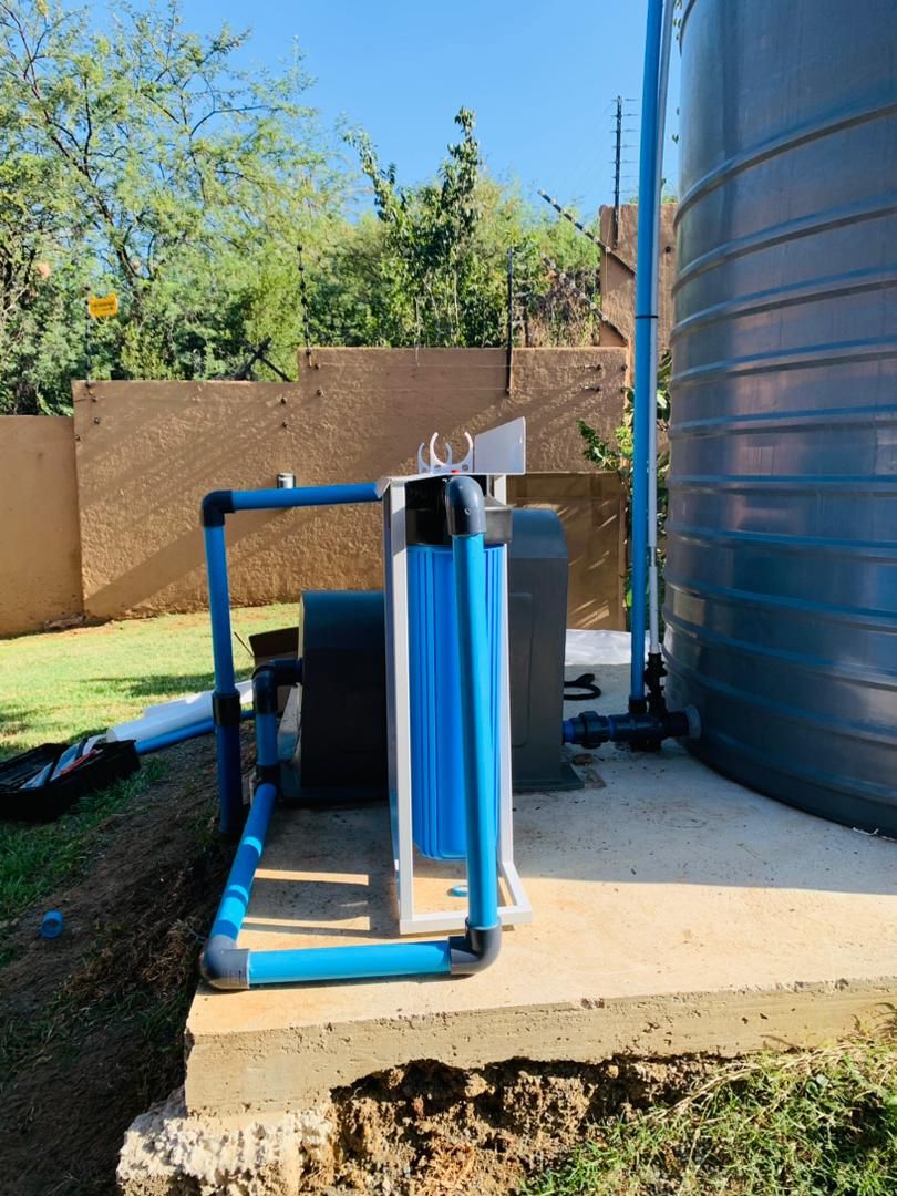 Blue pipe connected to water tank