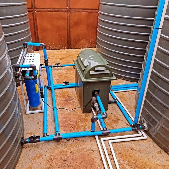 Water tanks with blue pipes